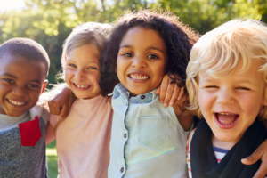 four children smiling at camera