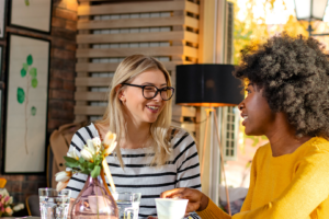 Two women having coffee and chatting