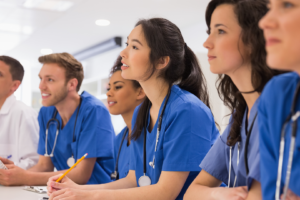 Medical residents paying attention to presentation