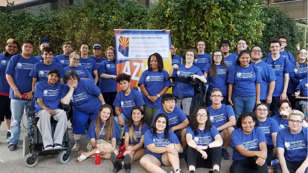 group of young self advocates in blue t-shirts