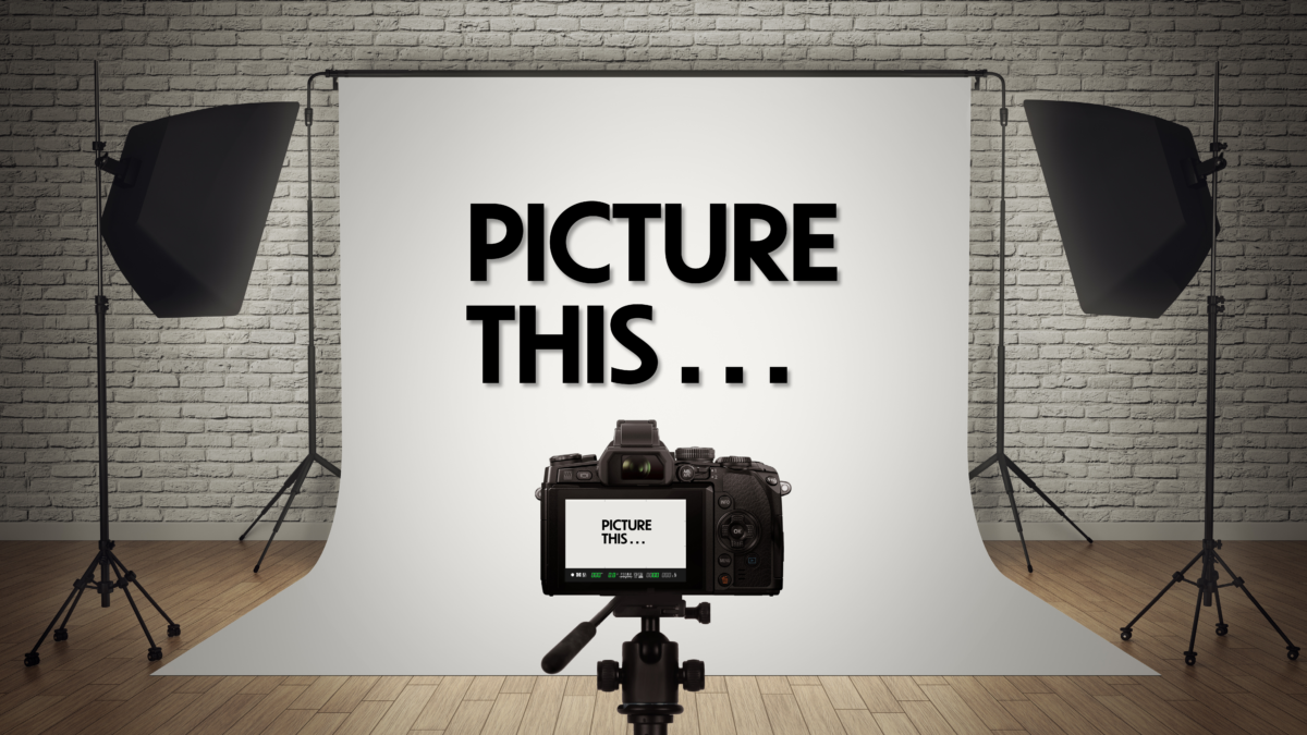 photography studio with camera focused on lighted screen reading 'picture this'