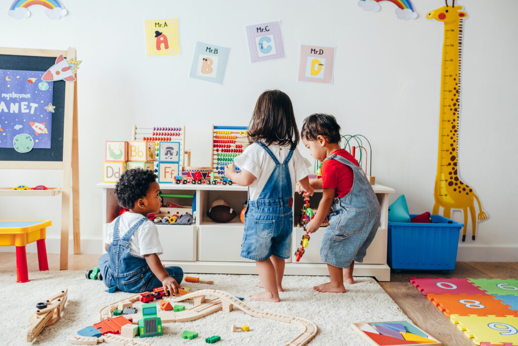 Young children enjoying playing in a playroom