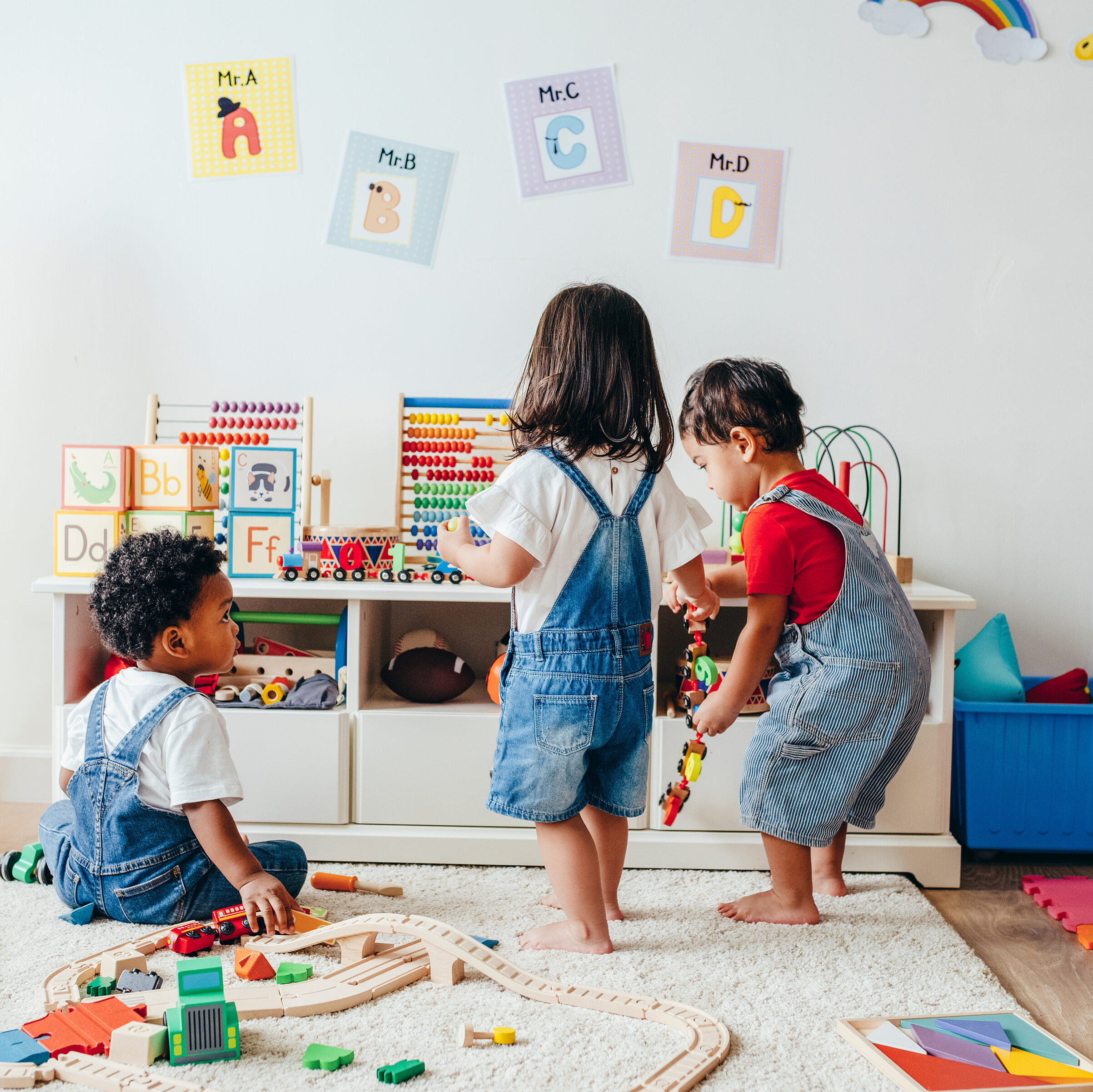 Young children enjoying playing in a playroom